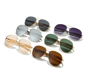 Close-up of metal aviator sunglasses with double bridge in multiple lens colors