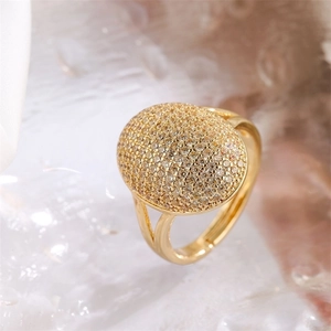Detail of gold-plated ring featuring oval micro-pave cubic zirconia and split shank