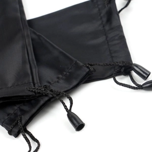 Black microfiber drawstring pouch for sunglasses featuring a sleek plastic cord stopper