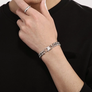 Minimalist silver Cuban link bracelet with rectangle buckle shown on a male wrist
