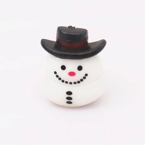 Close-up of a miniature snowman ring with a black top hat for Christmas party favors