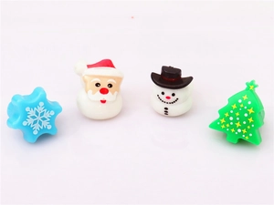 Detailed view of four festive LED Christmas rings featuring Santa, Snowman and Tree designs