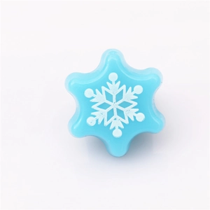 Close-up of blue snowflake ring with white print for Christmas parties and kids
