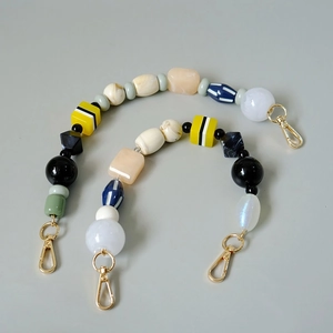 Handmade colorful beaded bag strap with mixed shapes and golden metal clasps