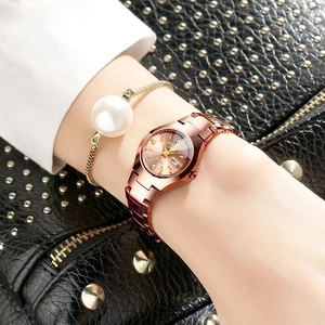 Elegant rose gold women's watch with sunburst dial and matching pearl chain bracelet