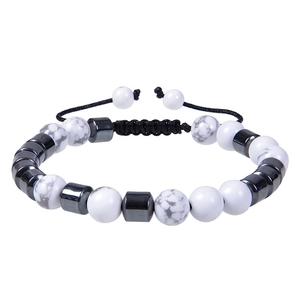 Detail of adjustable beaded bracelet with white marble stones and magnetic metal beads