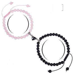 6mm pink zebra stone and black bead magnetic heart couples bracelets set on white background