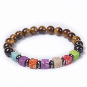 Tiger eye stone bracelet with colorful square natural gemstone beads on white backdrop