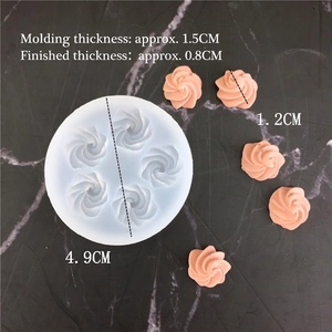 Detailed macro view of 6-hole daisy silicone mold with 4.9cm diameter and pink resin samples