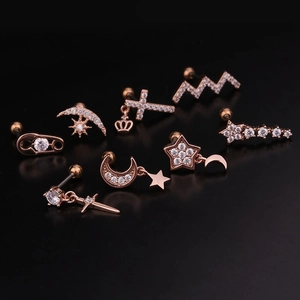 7-piece rose gold ear stud set featuring moon, star, and crown designs with cubic zirconia