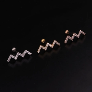 Detailed view of wave-shaped cartilage earrings in silver, gold, and rose gold finishes