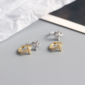 Detail of S925 sterling silver cross hoop earrings with sparkling zircon stones