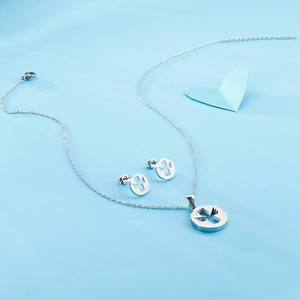 Silver stainless steel jewelry set with hollow angel pendant necklace and stud earrings