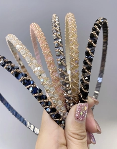 Detailed close-up of handmade crystal beaded headbands in various elegant colors