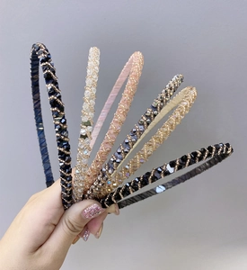 Detail showing various colors of slim crystal beaded headbands for women hair styling