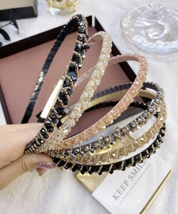 Close-up of handmade crystal beaded headbands with sparkling rhinestones in various colors