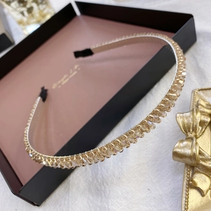 Close-up of amber crystal beaded headband with slim gold metal frame and non-slip tips