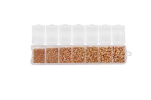 DIY jewelry kit with gold and rose gold metal beads in a 7-slot clear storage organizer
