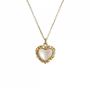 French vintage gold heart pendant necklace with shell inlay and retro embossed edges