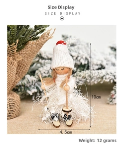 Detail of wooden Christmas girl doll with knitted hat and skis, size 10cm by 4.5cm