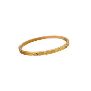 Gold stainless steel bangle with marquise eye motifs and embedded zircon accents