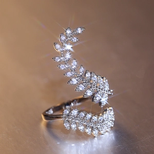 Macro detail of silver leaf wrap ring with sparkling zircon micro-pave setting