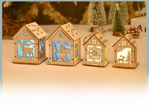 Close-up of four DIY wooden LED Christmas cabins with reindeer and snowflake cutouts