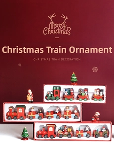 Detailed view of red and green wooden Christmas train set in premium window box packaging