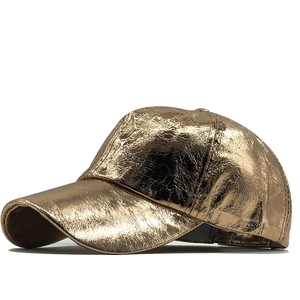 Close-up of golden metallic PU leather baseball cap with reflective crinkle texture