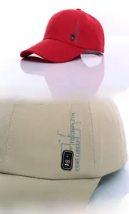 Close-up of cotton baseball cap stitching and side badge logo details in red and khaki