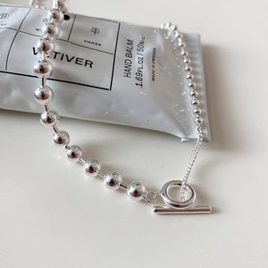 Detail of 925 sterling silver bead chain necklace with minimalist toggle clasp design