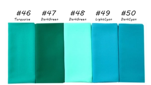 Detail view of pearl chiffon shawl color options from turquoise to dark green tones