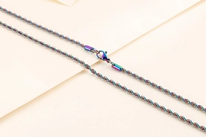 Detailed view of colorful twisted rope chain necklace with lobster clasp in stainless steel