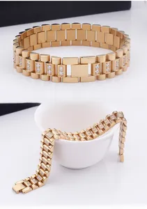 Detailed view of a gold-plated men's link bracelet with sparkling paved zircons