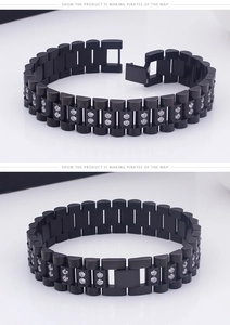 Detail of black stainless steel bracelet with president link design and clear cubic zirconia
