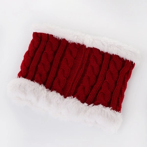 Detail of red cable knit neck warmer with thick white faux fur lining for winter