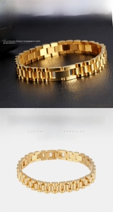Detail of gold titanium steel bracelet featuring classic brushed watch band links