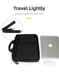 Detailed view of black waterproof laptop briefcase with dual front pockets and shoulder strap