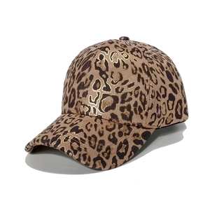 Women's baseball cap with leopard print and gold foil details in a 45-degree angle view