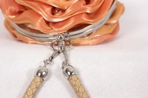Elegant orange silk satin evening bag with 3D rose flower design and metal clasp