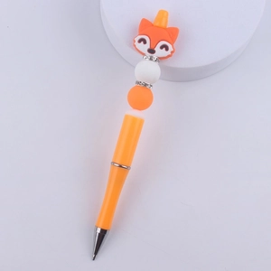 Close-up of orange bead pen with cartoon fox silicone head and colorful decorative beads