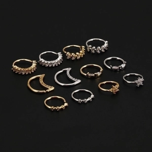 Star moon floral 20G zircon nose rings in gold and silver plating on black background