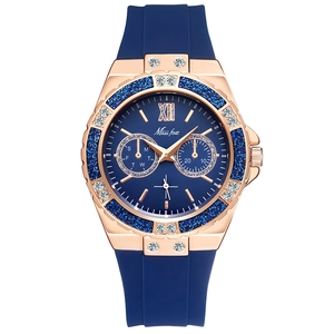 Detail of rose gold watch case with blue glitter bezel and luxury rhinestone accents