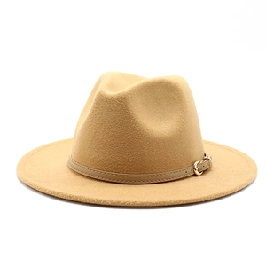 Detail of camel wool fedora hat featuring a leather band with a golden metal buckle