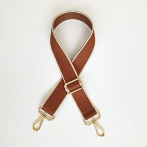 Detailed view of adjustable 3.8cm brown and cream striped bag strap with gold metal hooks