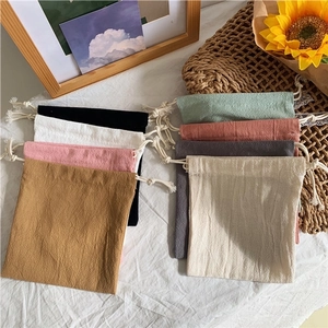 Minimalist drawstring storage bags in various colors made of cotton linen fabric