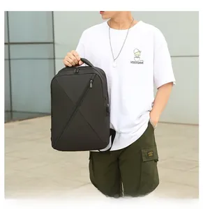 Detail of minimalist black Oxford laptop backpack with modern diagonal geometric stitching