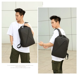 Front and side view of waterproof black nylon backpack worn by a male model outdoors