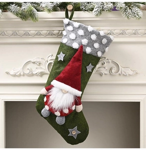Detail of green Christmas stocking featuring a 3D gnome doll and plush fleece textures