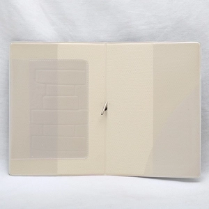 Beige faux leather passport holder cover with card slots on white fabric background